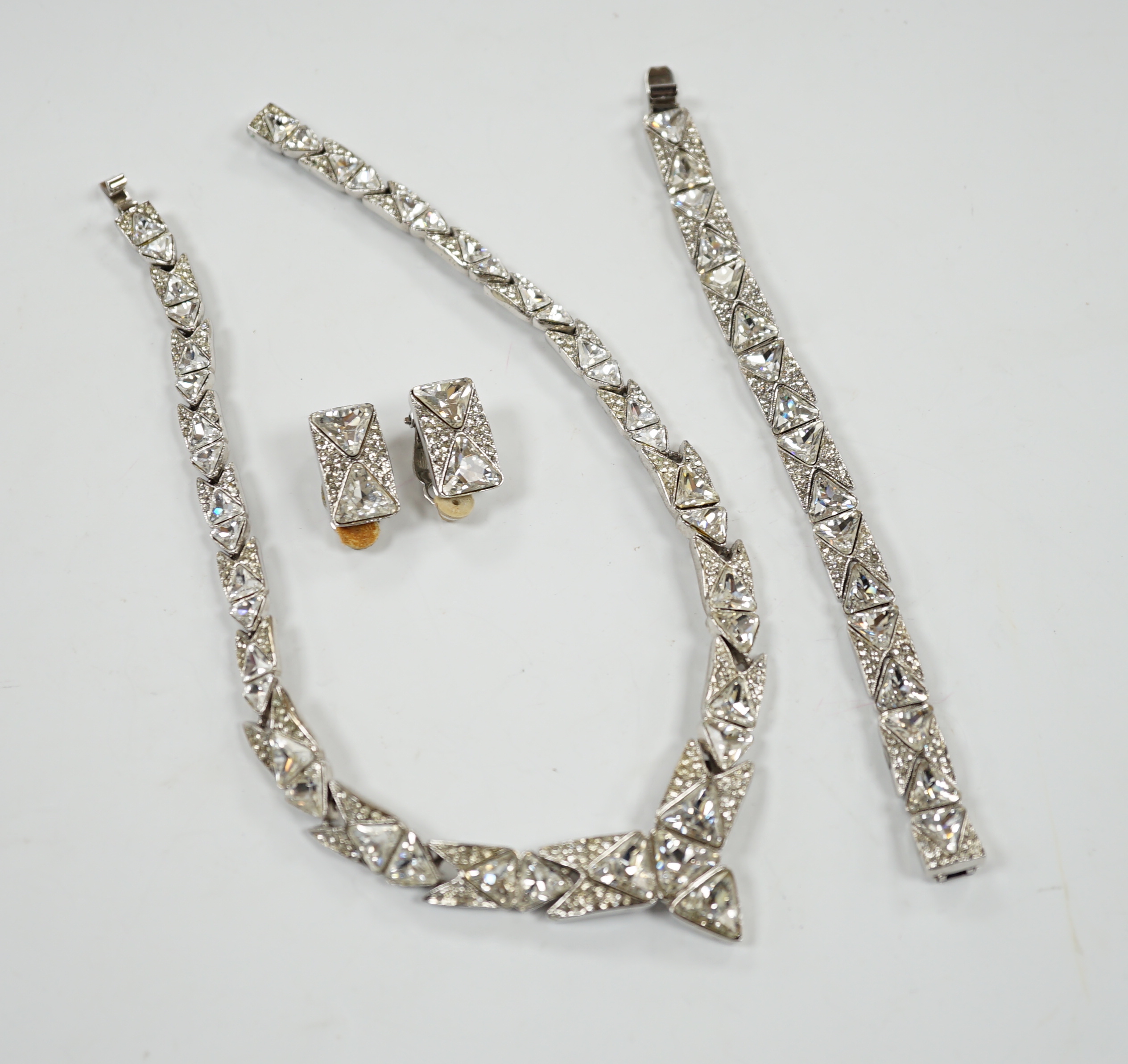 A suite of white paste set jewellery, comprising a necklace, bracelet and pair of earrings, in a Butler & Wilson box, bracelet 16.5cm.